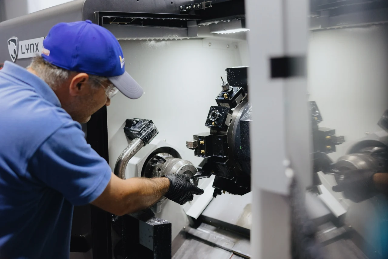 MNT operator setting up a CNC lathe